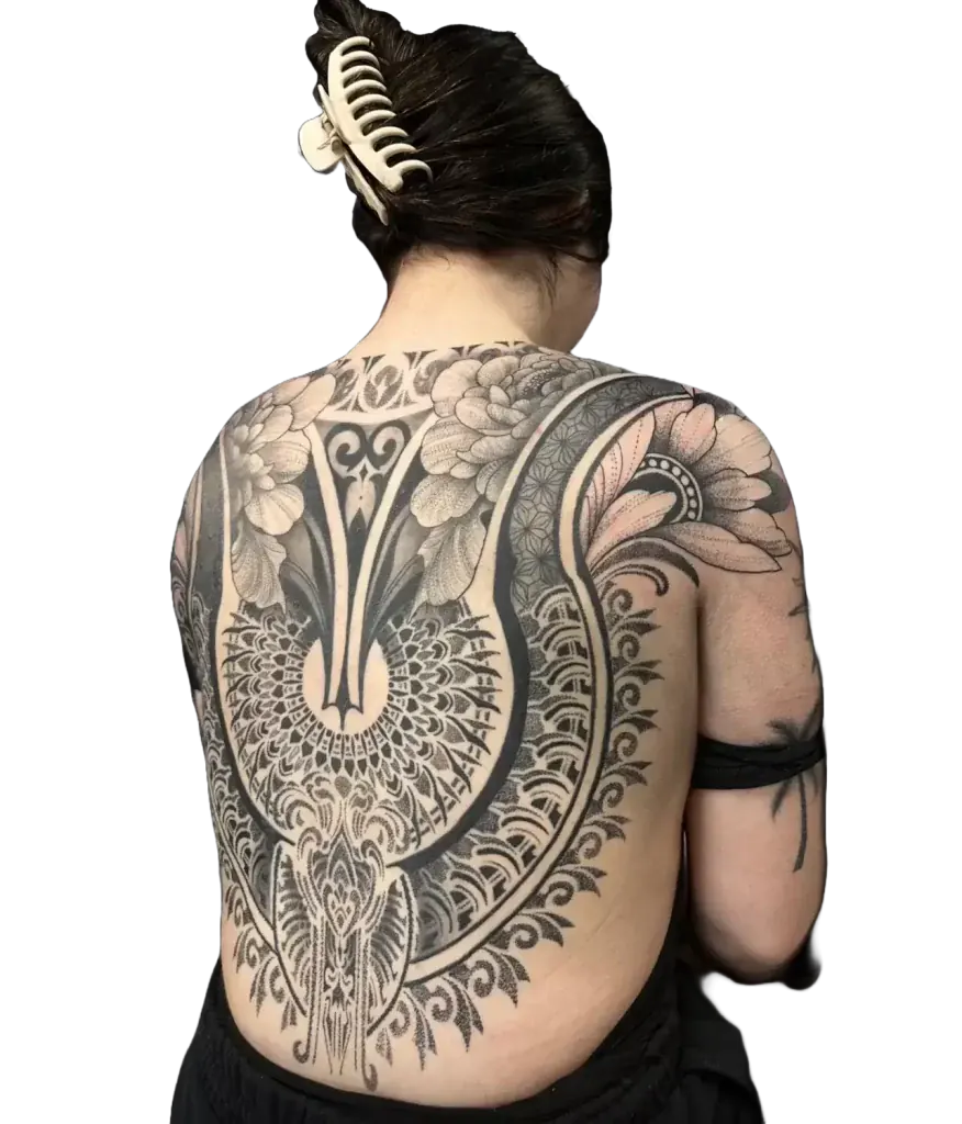 Womens back tattoo with a floral mandala and lace ornamental design in fine line and dotwork by Duk Tattoo, Florida