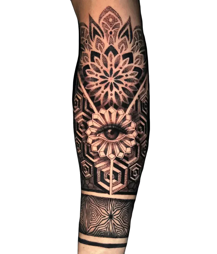 Forearm tattoo of an eye framed by sacred geometry and mandala patterns in black and grey by Duk Tattoo