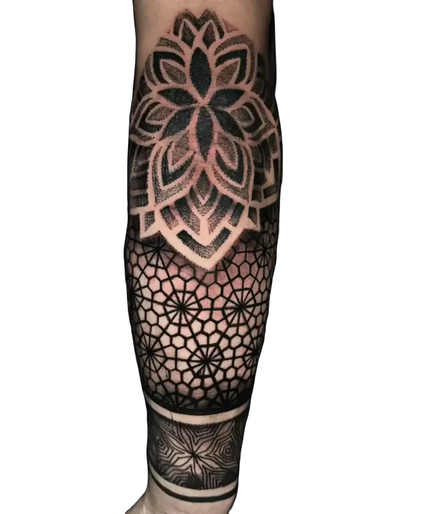 Forearm geometric tattoo with a mandala, honeycomb pattern and dotwork shading by Duk Tattoo, Boca Raton
