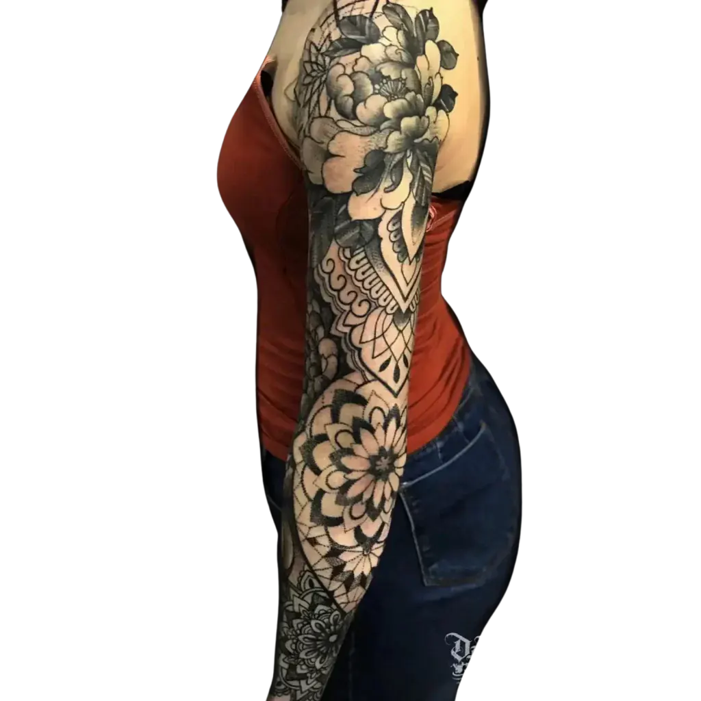 Womens full arm sleeve tattoo mixing black and grey flowers with geometric mandalas by Duk Tattoo, Florida