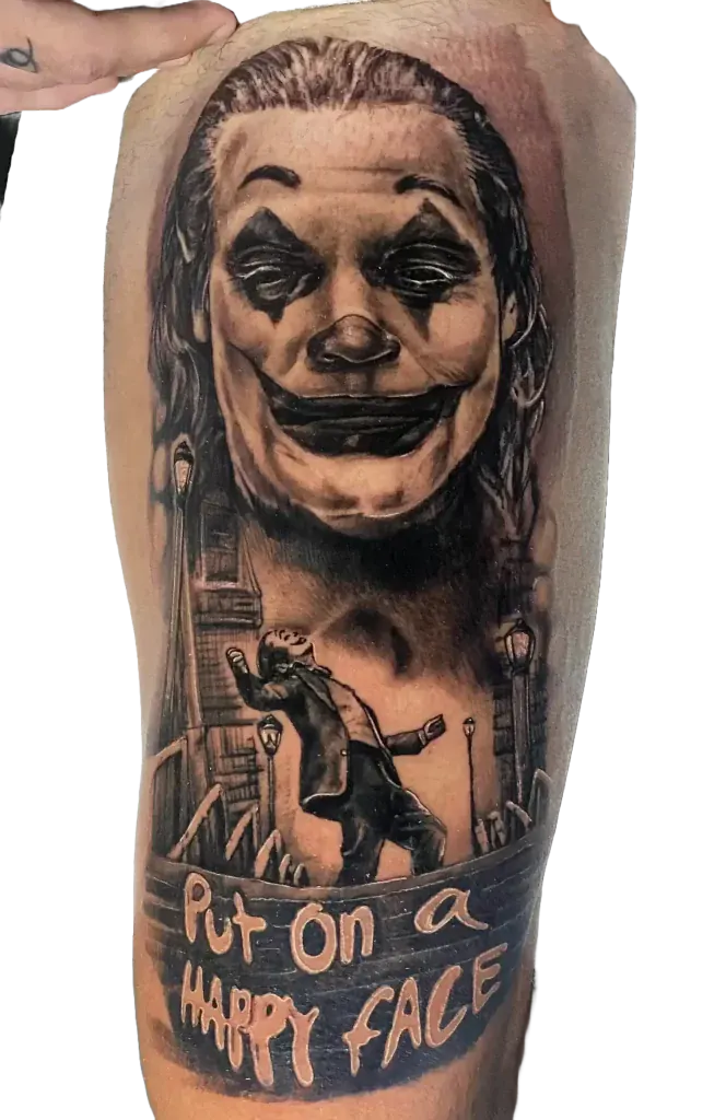 Black and grey Joker portrait tattoo with the quote Put on a happy face, by Duk Tattoo, Boca Raton, Florida