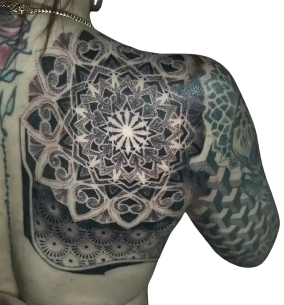 Shoulder and chest mandala shield tattoo with geometric honeycomb dotwork by Duk Tattoo, Florida