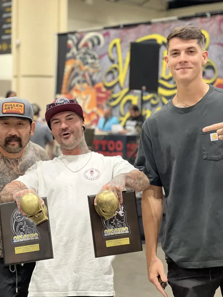 Duk Tattoo holding the 2nd best paint and 3rd best chest piece trophies at the Orlando Tattoo Festival 2024