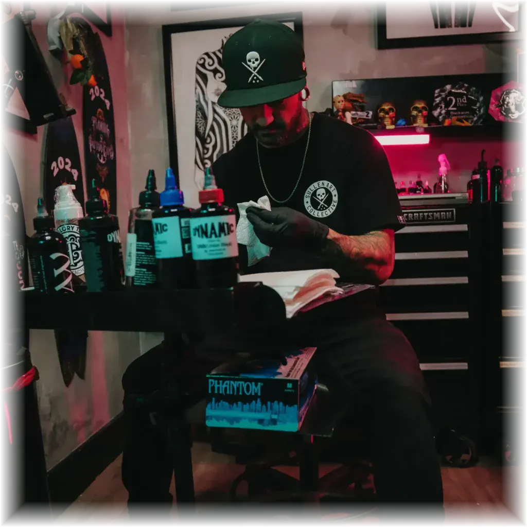 Award-winning tattoo artist Duk Tattoo at his workstation in his Boca Raton studio