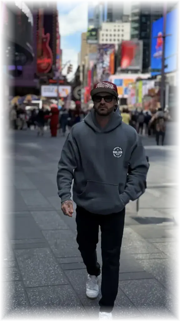 Tattoo artist Duk Tattoo walking through Times Square, New York