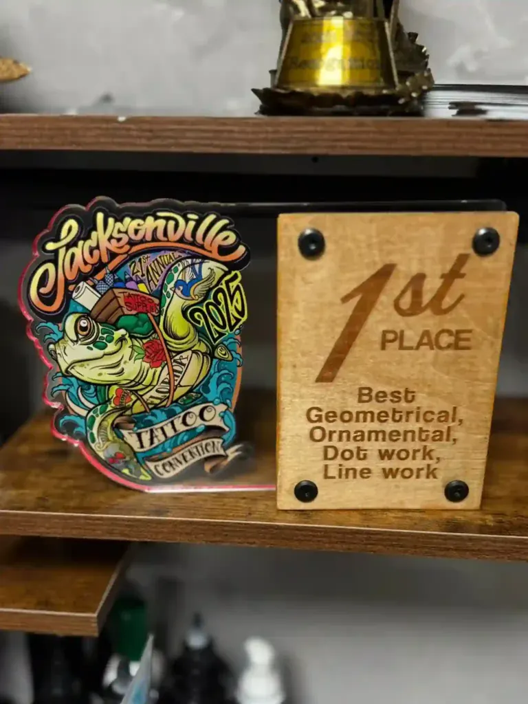 1st place plaque for best geometric, ornamental, dotwork and line work won by Duk Tattoo at the Jacksonville Tattoo Convention 2025