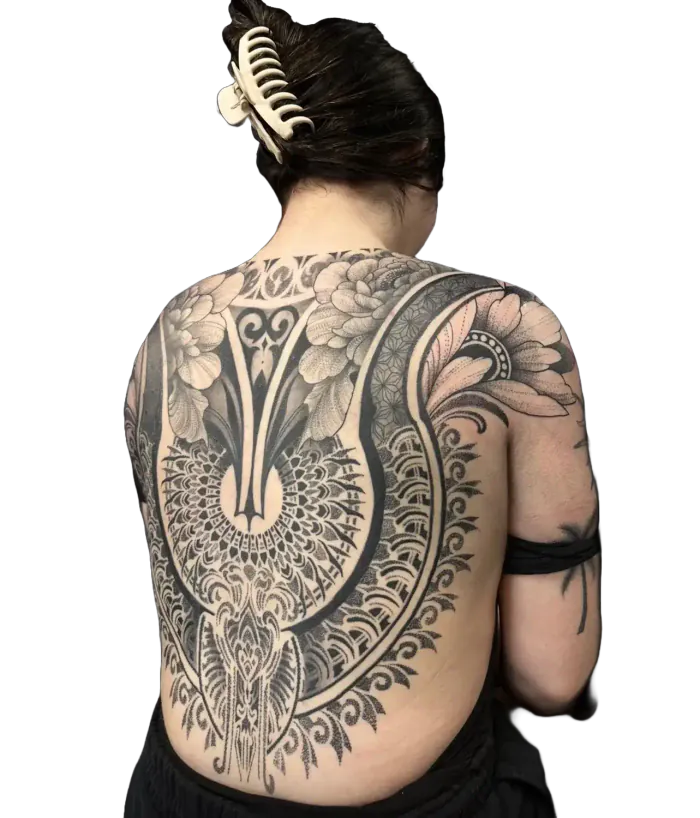 Womens back tattoo with a floral mandala and lace ornamental design in fine line and dotwork by Duk Tattoo, Florida
