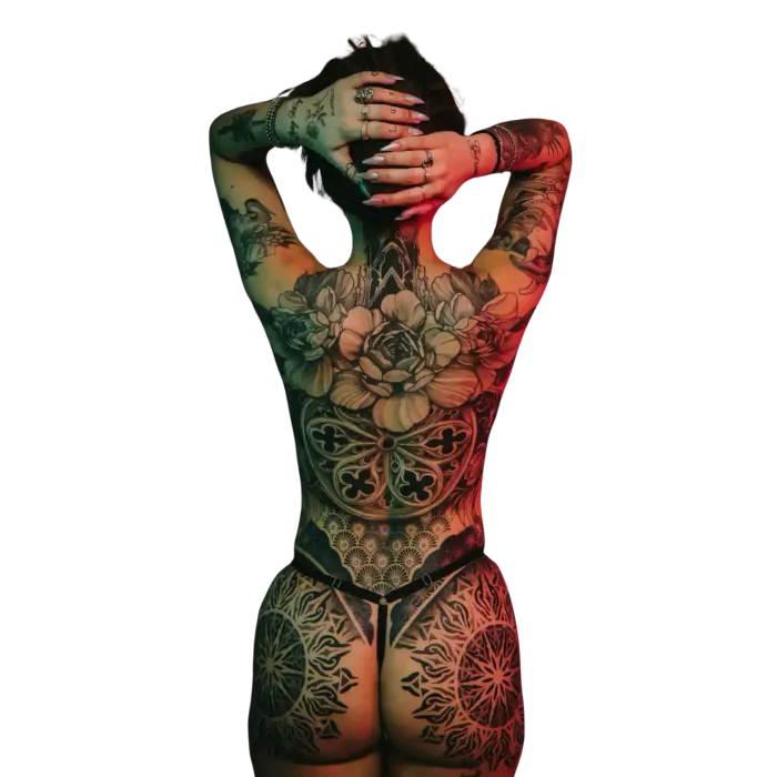 Full back and hips ornamental tattoo on a woman with a rose, mandalas and lace patterns in black and grey by Duk Tattoo, Florida