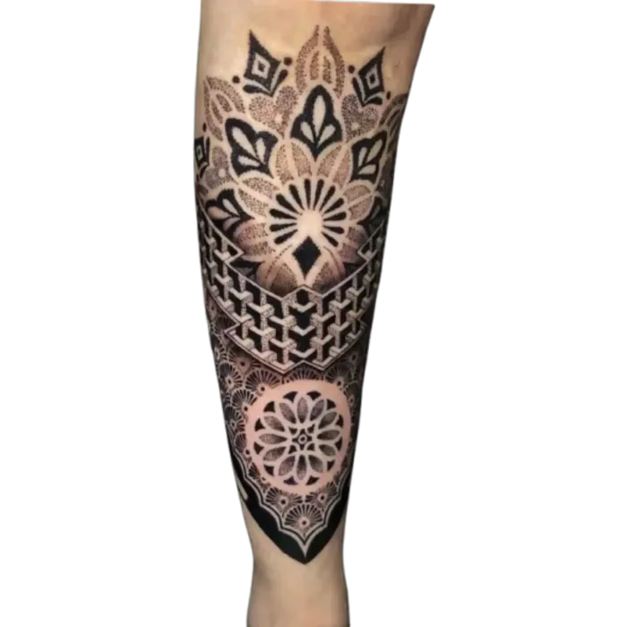 Geometric mandala shin tattoo with stacked sacred geometry patterns in black ink by Duk Tattoo, Boca Raton